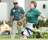 Robyn Stawski throws a discus.